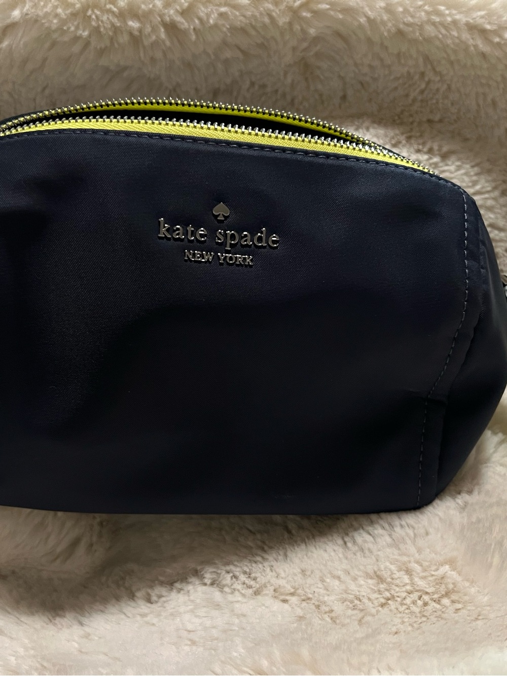 kate spade navy cosmetic pouch with yellow zipper